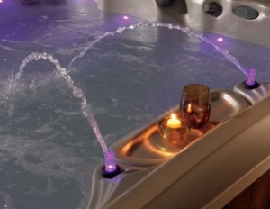 LED points of light encircle the hot tub below the water line and highlight the exterior in all directions