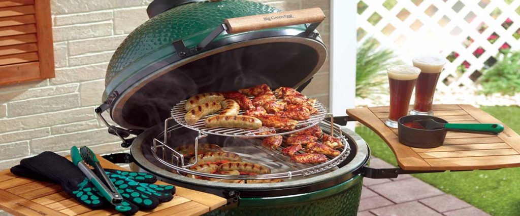 big green egg open with different meats
